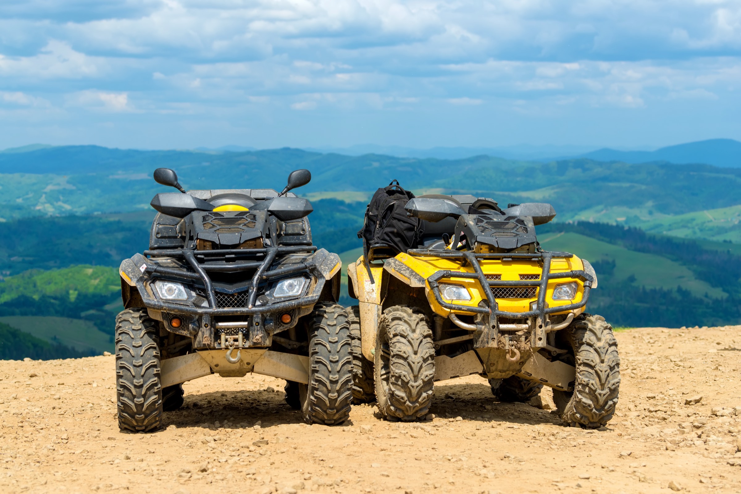 Quad bikes ready for an off-road tour in the mountains
